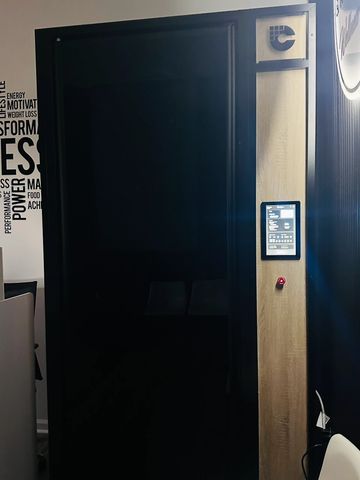 A tall black machine with a control panel.