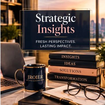 Desk with business books, glasses, and a coffee mug with city view.