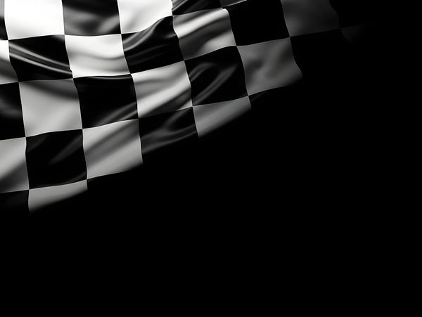 A waving black and white checkered racing flag on a black background.