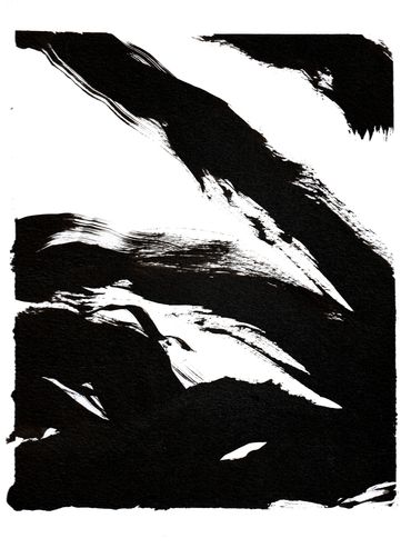 Abstract black ink brush strokes on a white background creating dynamic shapes.