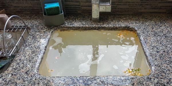 A clogged kitchen sink 