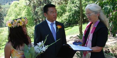 Alison Moore officiating wedding at Raven's View Farm in Peachland, BC