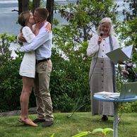 Alison Moore wearing a white and light gray attire for a wedding