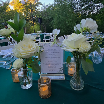Purple & White centerpieces for wedding guest table