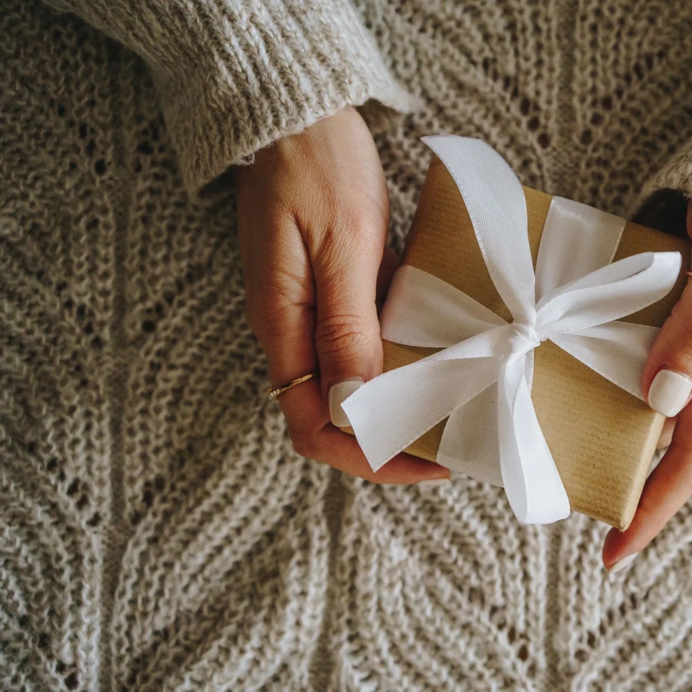 Female client holding a gift box 
