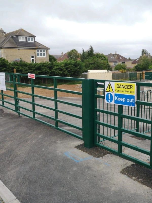 Metal school gates with gate signage