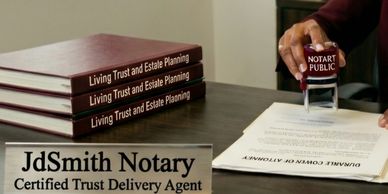 A notary public stamping a document with trust and estate planning books nearby.
Trust and Estate Pl