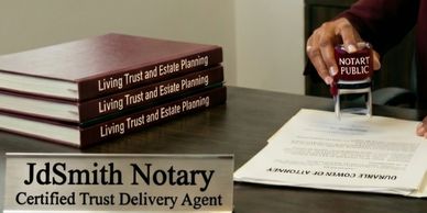 A notary public stamping a document with trust and estate planning books nearby.
Trust and Estate Pl