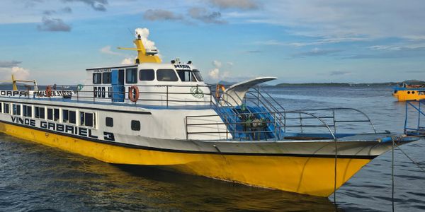 Vince Gabriel yellow and white Ferry docked in the water in Dinagat Islands Philippines