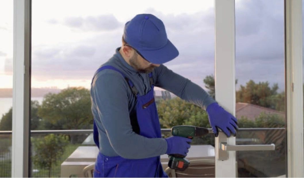 A man working on a door