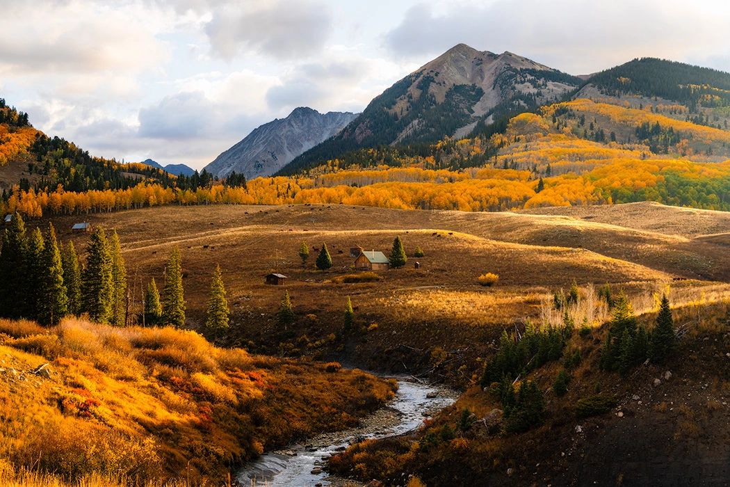 Sunrise golden light over a wooden cabin in Gothic Valley near Crested Butte, Colorado Sunrise golden light over a wooden cabin in Gothic Valley near Crested Butte, Colorado