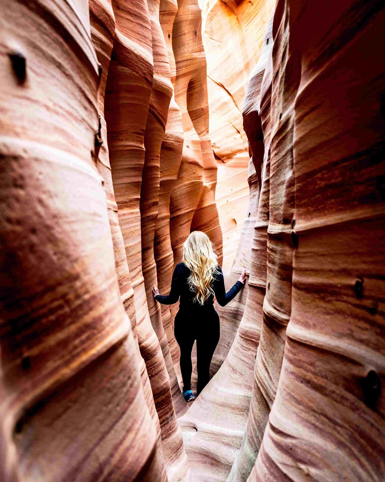 Walking through Zebra Slot Canyon in the Grand Staircase Escalante National Monument