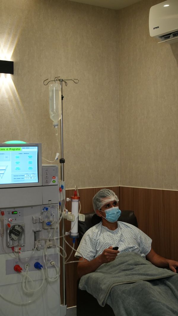 Patient receiving dialysis treatment in a medical clinic.