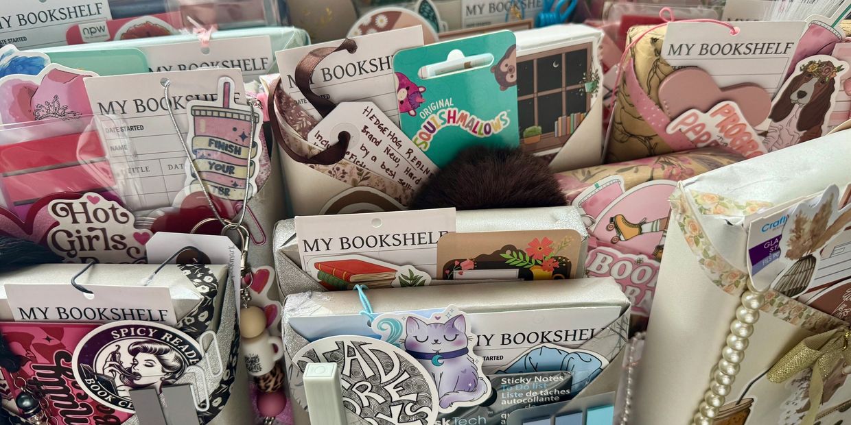A collection of colorful bookmarks and decorative paper clips labeled 'MY BOOKSHELF'.