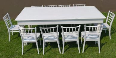 white table and tiffsny chairs