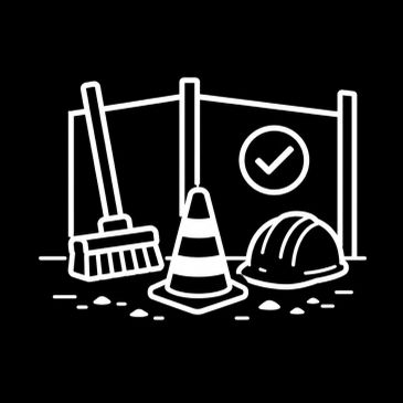 Construction safety gear including a broom, traffic cone, and helmet.