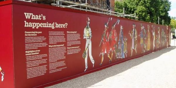 Informative red mural with historical military illustrations and text.