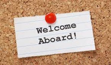 A note pinned with a red pushpin saying 'Welcome Aboard!'