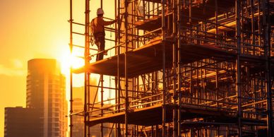 a man on the structure of a building 