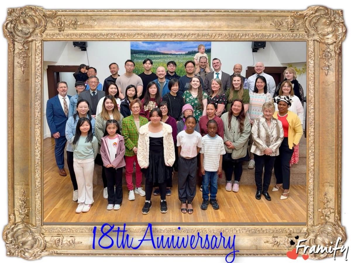 Group photo celebrating 18th anniversary.