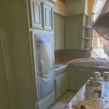 kitchen masked off in process of cabinets painting in Atascocita Texas 