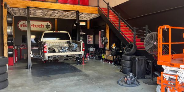 A truck undergoing repairs in an auto workshop.