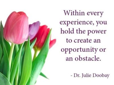 A motivational quote with tulips about creating opportunities or obstacles.