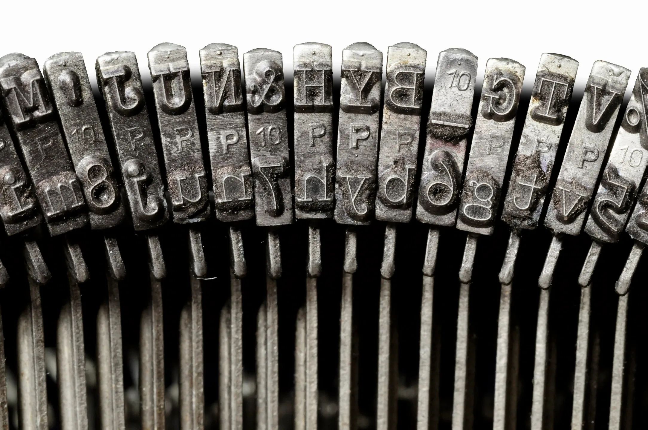 Old typewriter keyboard with striker keys.