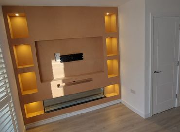 Media wall with LED lighting and recessed electric fireplace