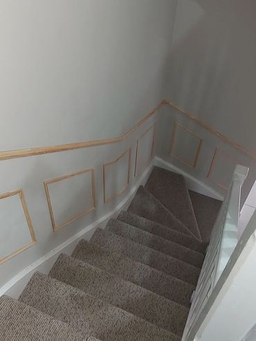 Wainscotting style wall panelling on stairs
