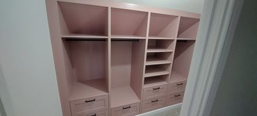 Walk-in wardrobe storage solution finished in Pressed Petal