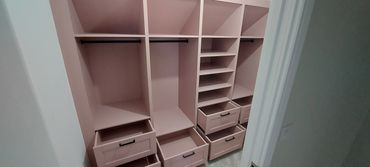 Walk-in wardrobe storage solution finished in Pressed Petal