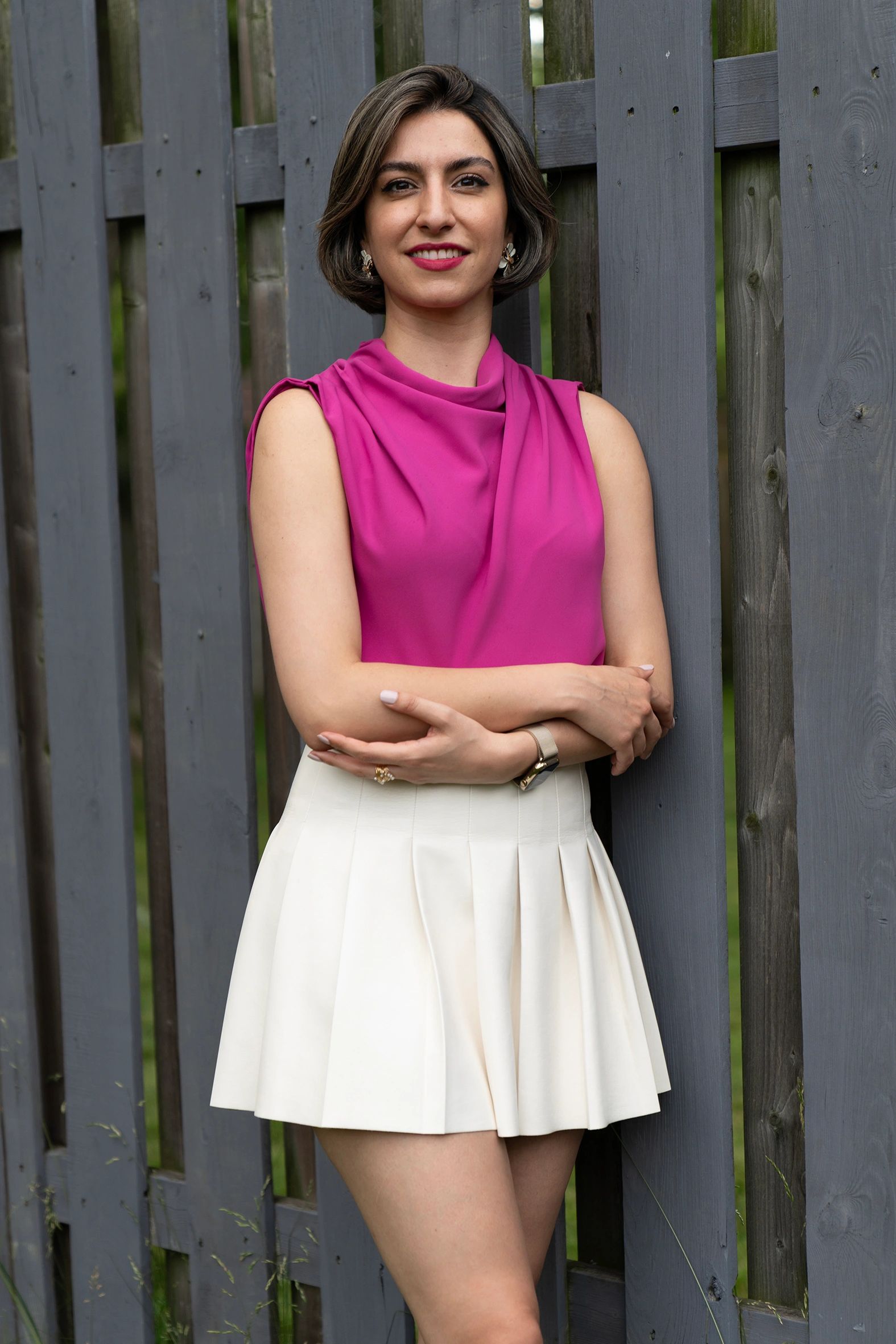 High contrast artistic portrait with studio light design in Toronto for Woman in a pink top and whit