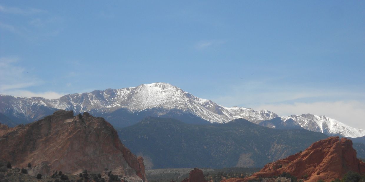 Snowy mountain peaks under a clear blue sky.