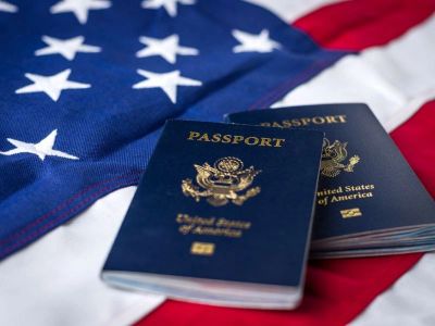 Two US passports on an American flag.