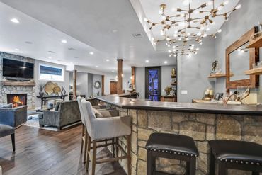 bar - wet bar - island - stools - backsplash - lighting