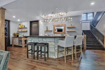 bar - wet bar - island - stools - backsplash - lighting