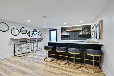 bar - wet bar - island - stools - backsplash - lighting