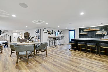 bar - wet bar - island - stools - backsplash - lighting