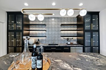 bar - wet bar - island - stools - backsplash - lighting