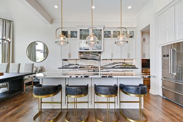 Kitchen island - lighting - cabinets - counter stools