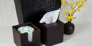 Brown tissue boxes with yellow flowers and wicker basket.