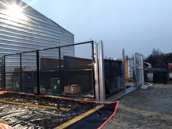 a security compound for valuable scrap metals - installation of fence board tbc by another