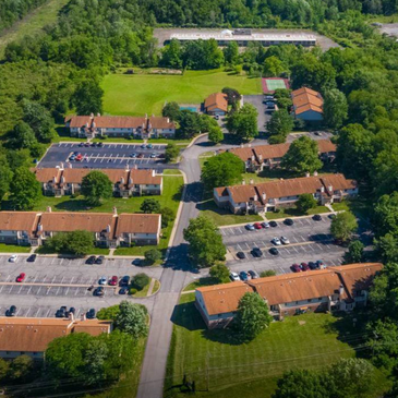 Photo of Pine Tree Village and Newbery Apartments, two older exclusive listings.