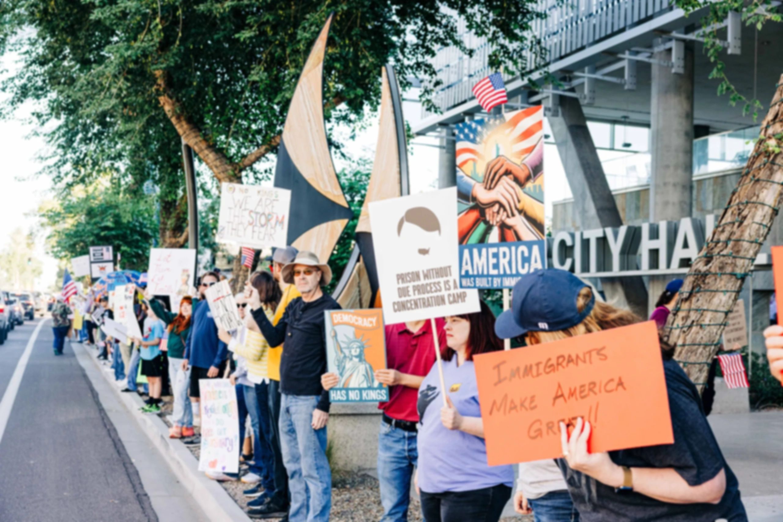 Group of people protesting on the sidewalk in front of Chandler City Hall 