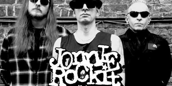 Jonnie_Rockit is:

Jonnie_Rockit- Vox & Guitars
John_Servo- Vox & Drums
KJ_Jones- Vox & Bass
