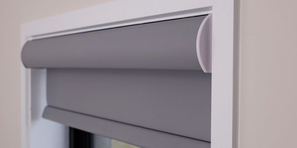 Electric roller blind in bedroom window