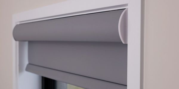 Roller blinds in bathroom window