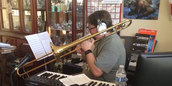 Musician (owner) recording himself on trombone