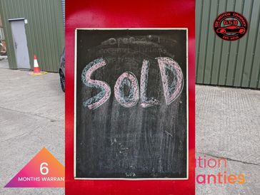 Chalkboard sign with 'SOLD' written in colorful chalk on a red background.